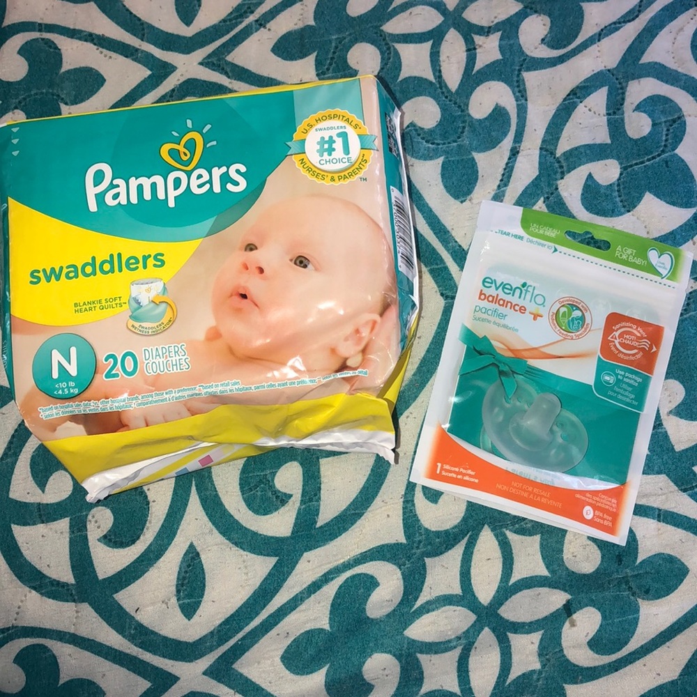 Newborn diapers and a newborn pacifier